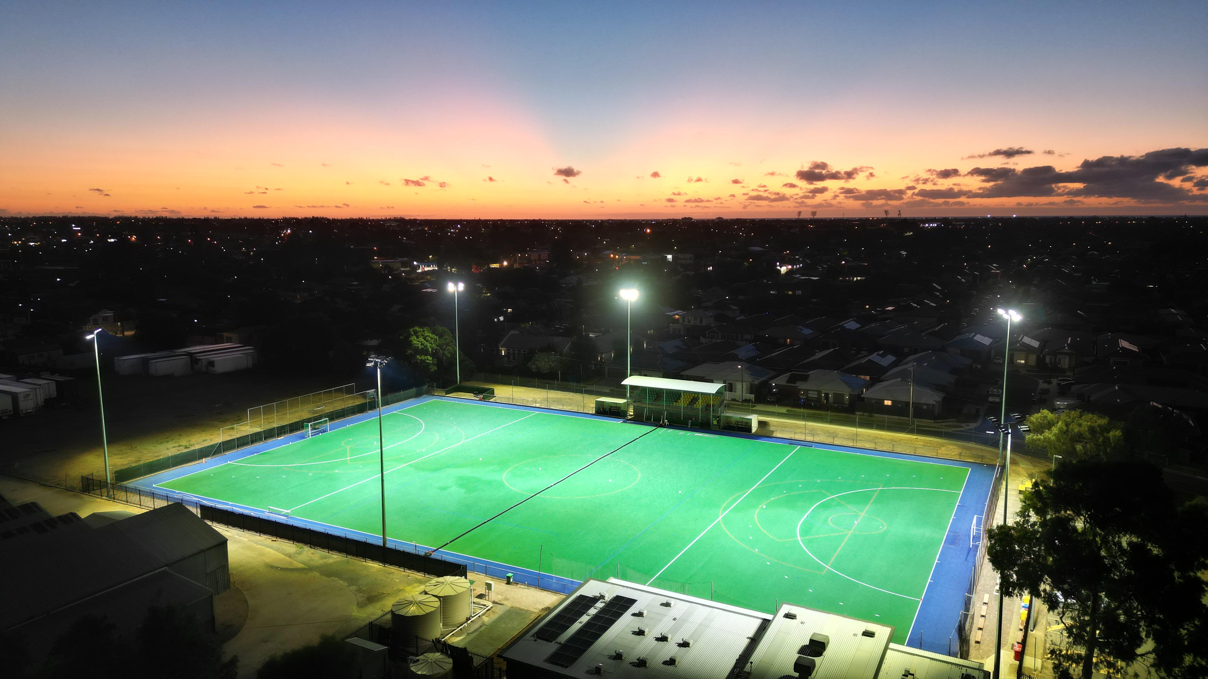 Image of hockey ground, shot from a drone, at the time of dusk.